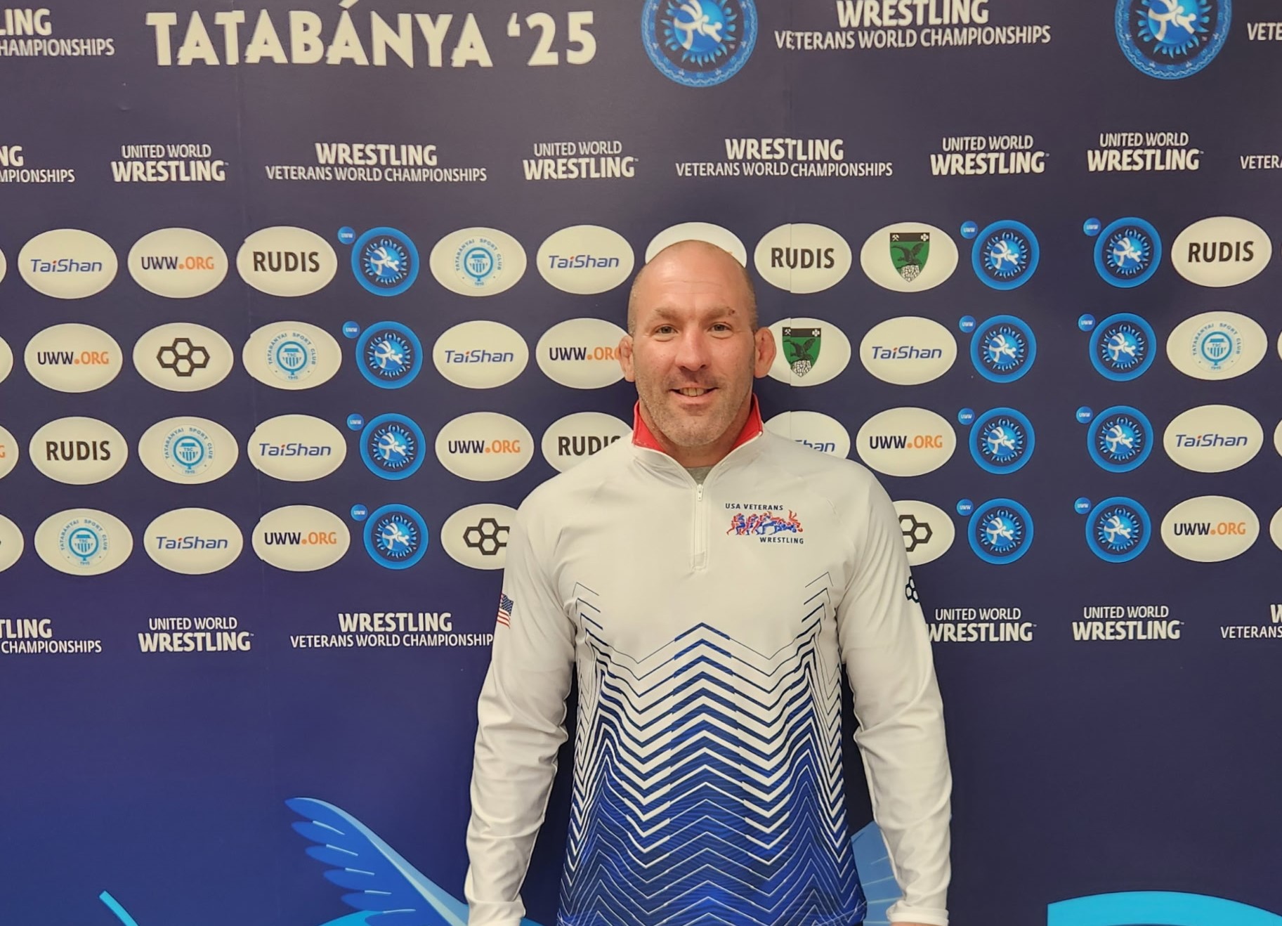 Assistant wrestling coach Mick Stormer poses for a photo at the Wrestling Veterans World Championships in Hungary.